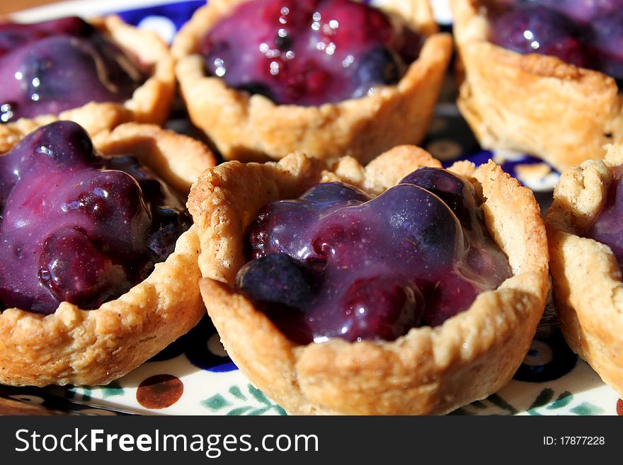 Miniature tarts on a plate ready to be served.