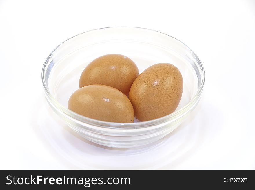 Closeup photo of chicken eggs in glass plate. Closeup photo of chicken eggs in glass plate