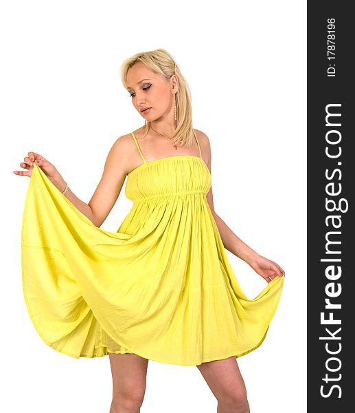 The girl in a yellow summer dress it is isolated on a white background. The girl in a yellow summer dress it is isolated on a white background.