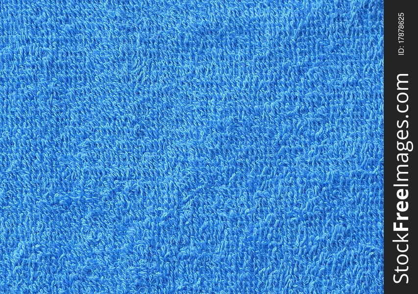 Bright blue terrycloth material for use as background or design elements. Bright blue terrycloth material for use as background or design elements