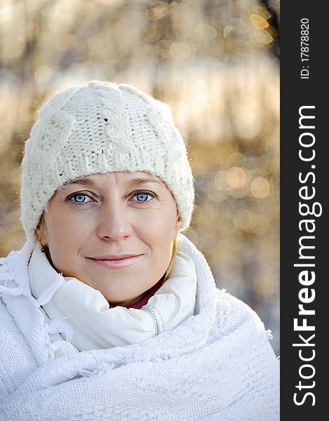 Portrait of woman in white, wrapped in a blanket. winter, outdoors. Portrait of woman in white, wrapped in a blanket. winter, outdoors.