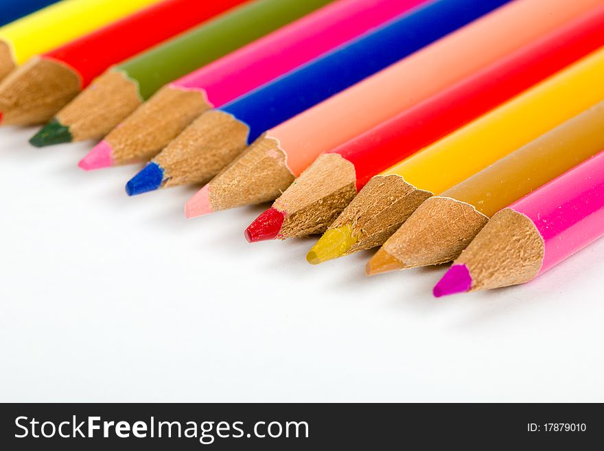 Colored pencils lined up in an angled row