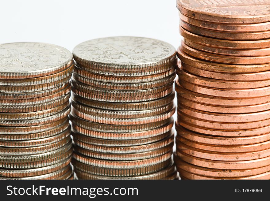 A tower of dimes and pennies against a white background. A tower of dimes and pennies against a white background