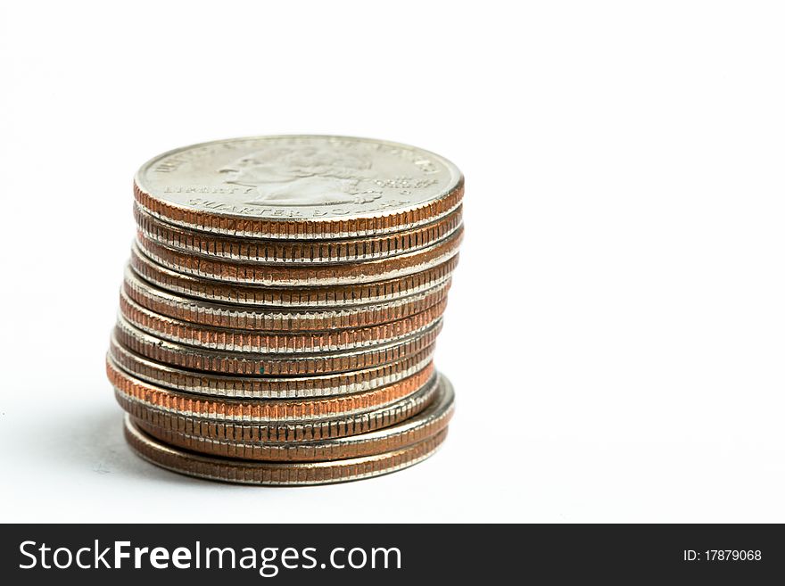 A tower of quarters against a white background. A tower of quarters against a white background