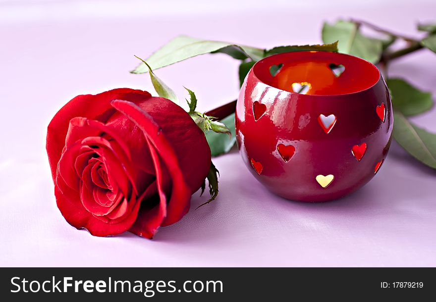 Beautifull red rose with romantic heart shaped candle holder.
