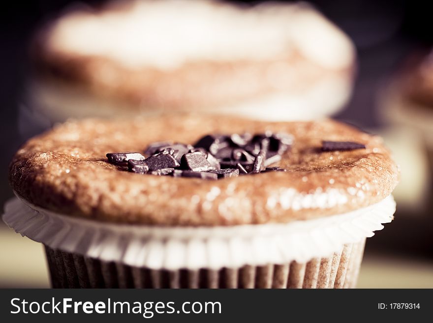 Fresh chocolate chip muffins . Macro with shallow dof.