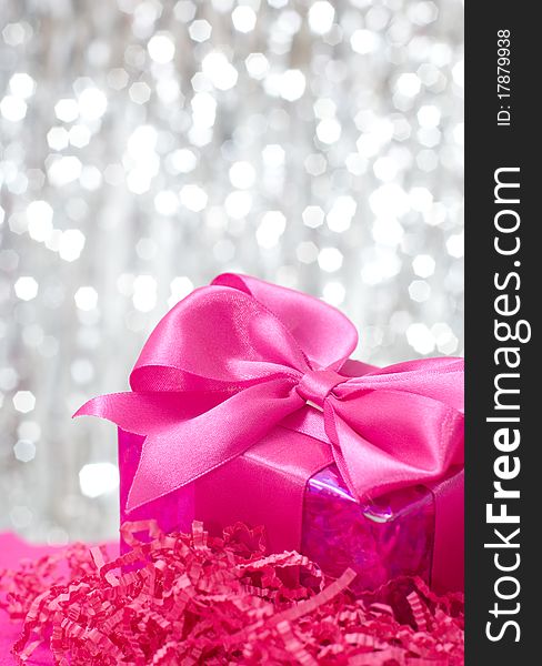 Pink box on shiny decoration. Pink box on shiny decoration
