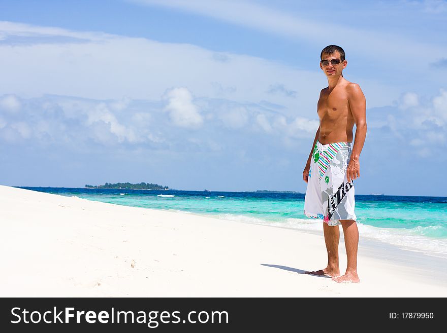 Young Man On A Tropical Beach