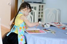 Adorable Little Girl With Long Dark Hair Draws Stock Photography