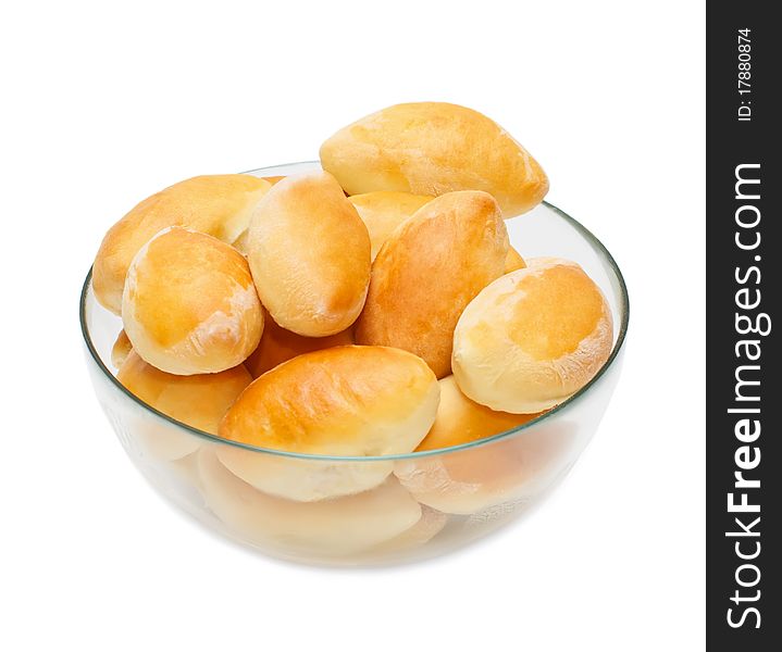 Full cup of warm homemade pasties on white background