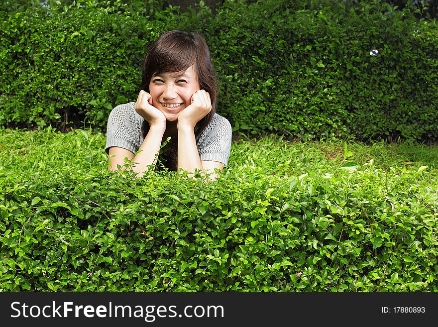 Attractive asian girl smiling in the park