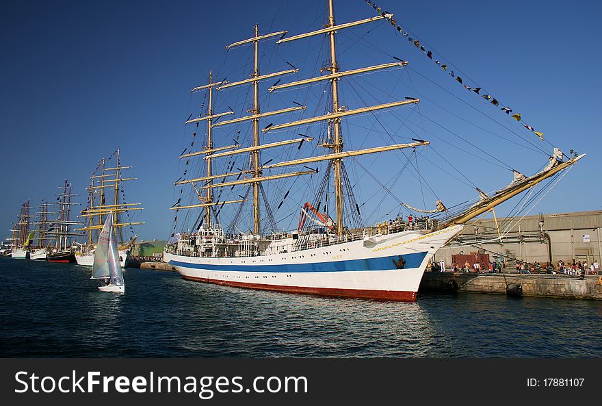 Tall sailing boats tied up for a race