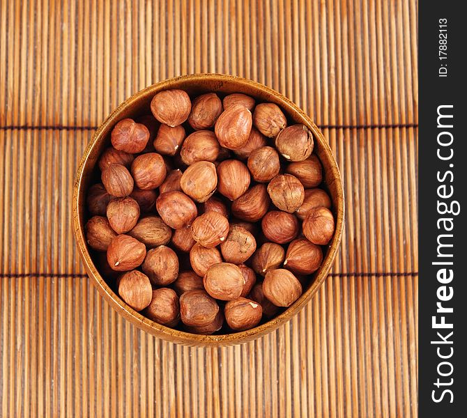 Peeled hazelnuts hazelnuts in a bamboo bowl. Peeled hazelnuts hazelnuts in a bamboo bowl