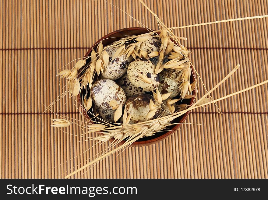 Quail eggs in a bamboo bowl