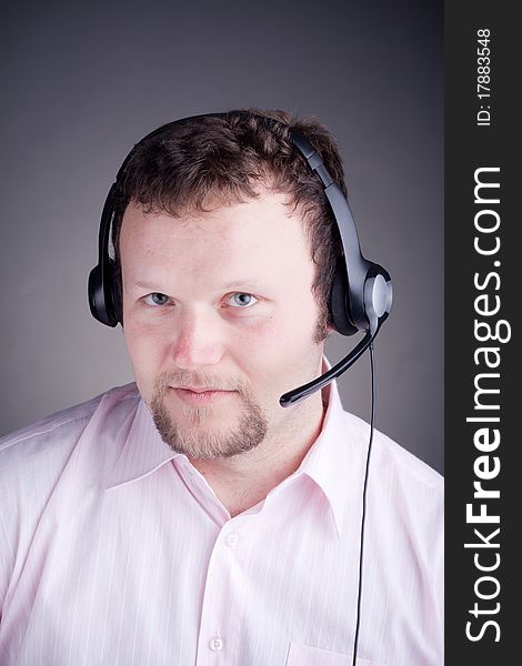 Smiling Male Customer Service Operator In Headset