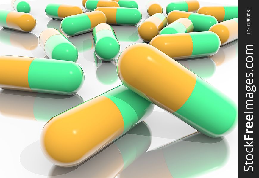 Orange and Green Pills on mirroring ground