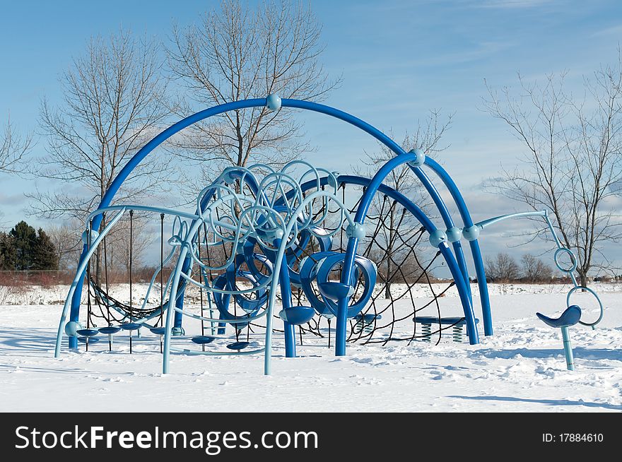 A play structure at a childrens' playground in winter. A play structure at a childrens' playground in winter.