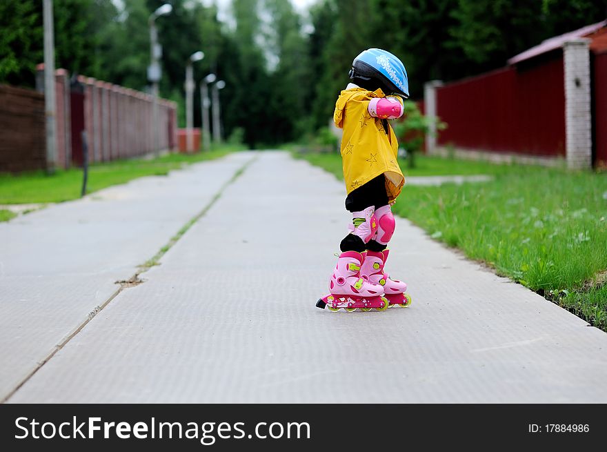 Adorable little girl on roller skates