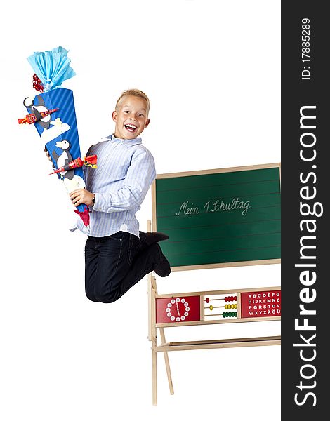 Boy on first school is happy and jumps in the air. Isolated on white background.