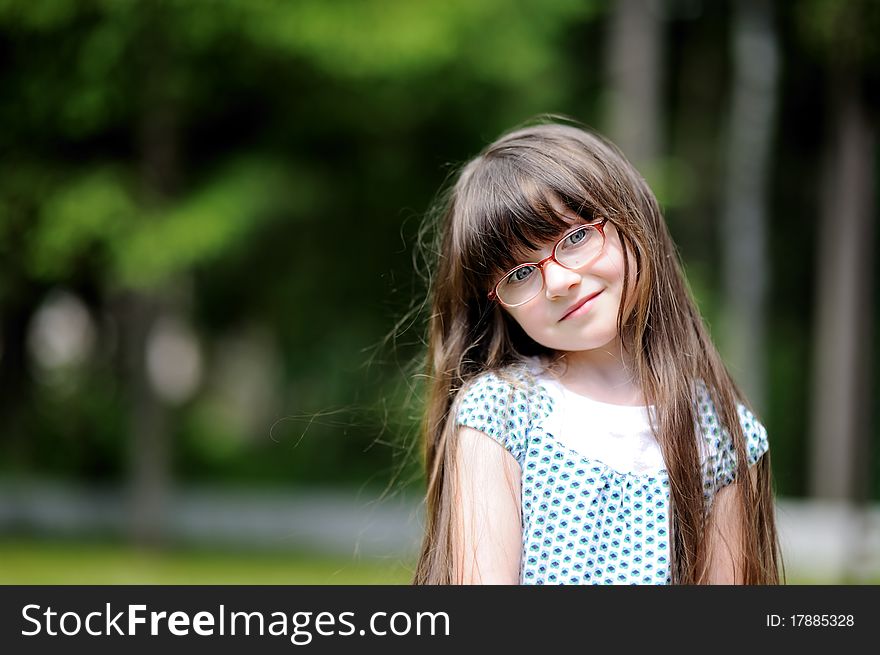 Spring Portrait of adorable little girl with long dark hair. Spring Portrait of adorable little girl with long dark hair