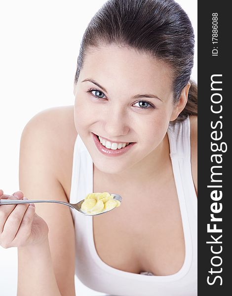 Attractive young girl with corn flakes. Attractive young girl with corn flakes