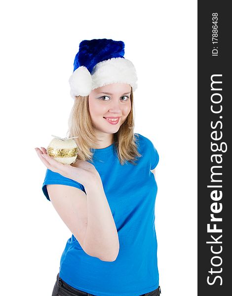 Smiling girl with Christmas tree balls and a hat of Santa Claus