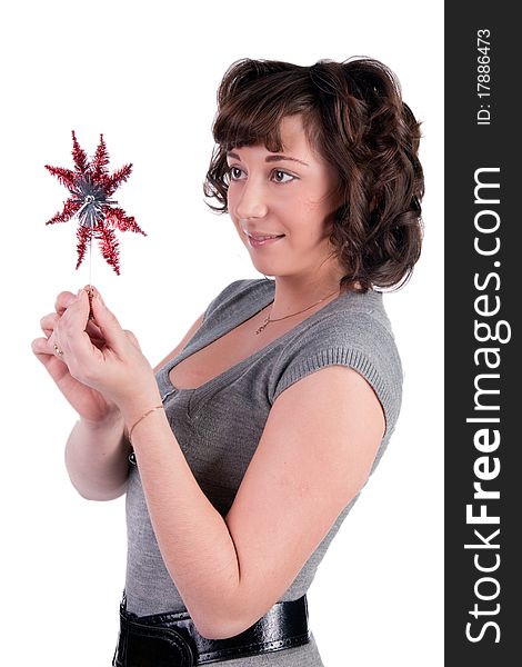 Beautiful woman holding christmas toy (red star). Isolated on white