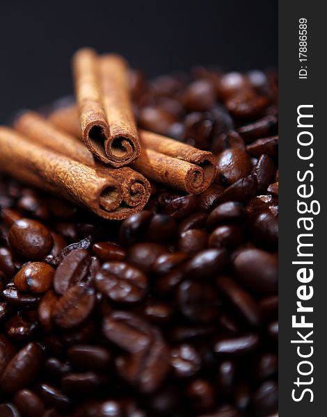 Coffee beans and canella sticks close up. Coffee beans and canella sticks close up