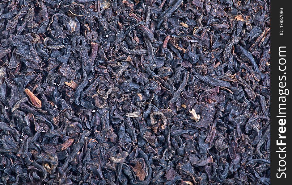 Macro photo of black tea leaves background