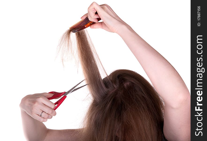 Woman with long hair and scissors on white