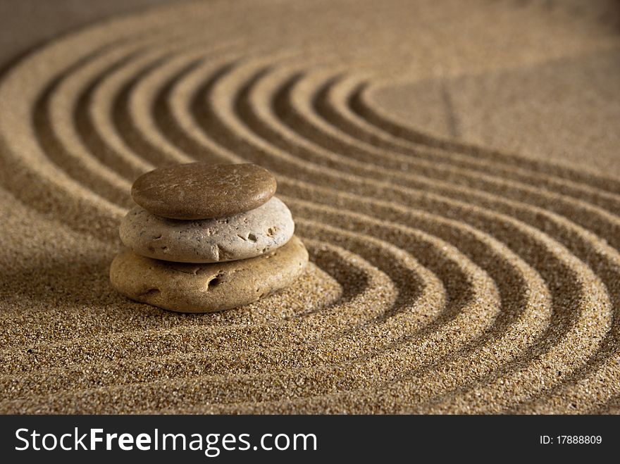 Stone on raked sand. Mini rock garden. Zen concept