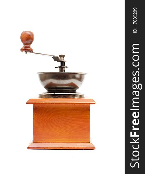 Old wooden worm eaten coffee mill isolated on a white background