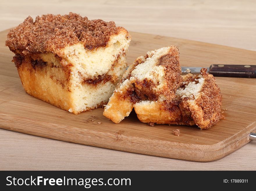 Sliced crumb cake bread on a cutting board