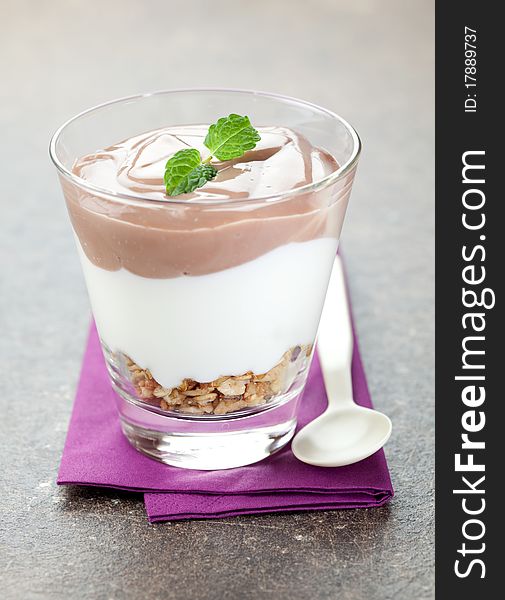 Fresh stacked dessert in a glass on napkin. Fresh stacked dessert in a glass on napkin