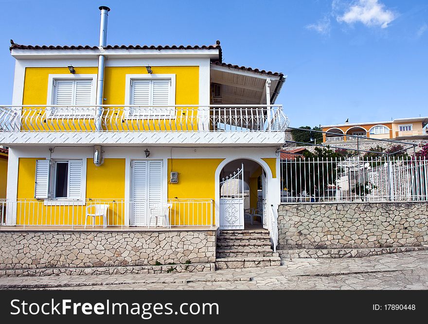 Yellow house with terrace in greece