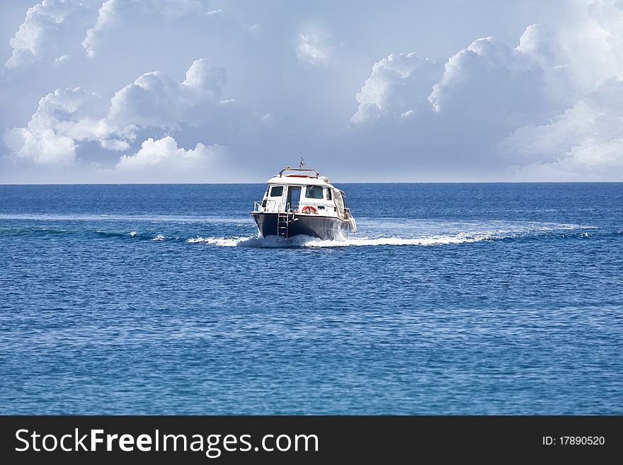 Small motor boat on the ocean