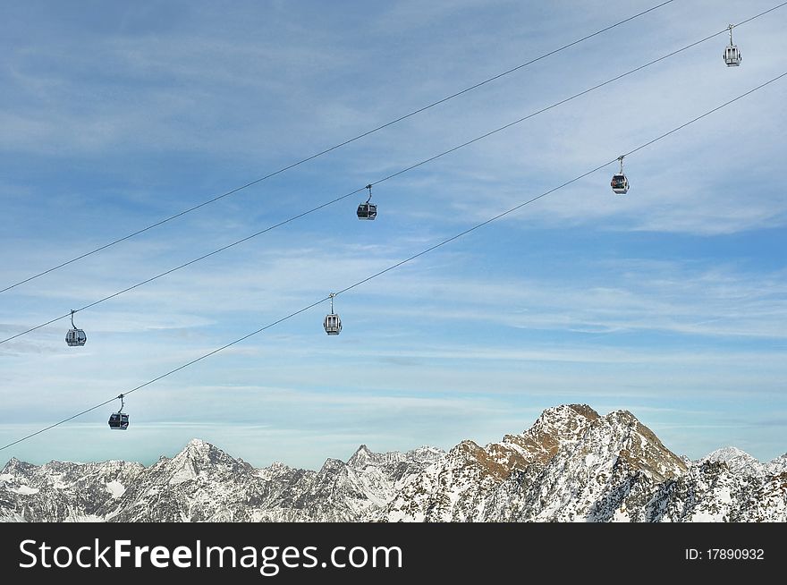 Gondola Ski Lift above Alps Mountains