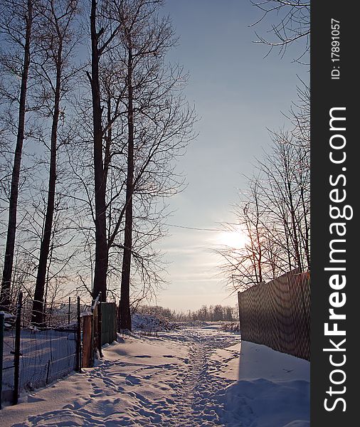 The sun on winter rural road to Moscow suburbs