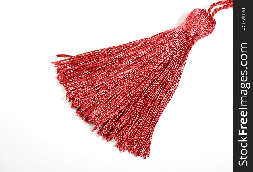 Red silk tassel isolated on white