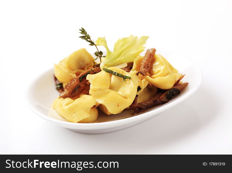 Italian cuisine - Stuffed pasta and mushrooms. Italian cuisine - Stuffed pasta and mushrooms