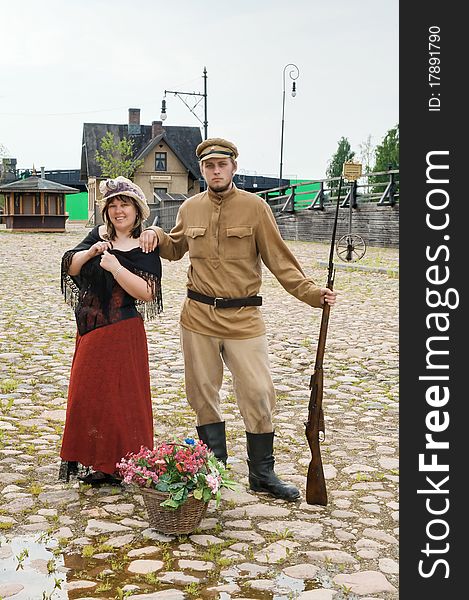 Couple of lady and soldier shown on retro-style picture. Costumes accord the times of World War I. Photo made at cinema city Cinevilla in Latvia. Couple of lady and soldier shown on retro-style picture. Costumes accord the times of World War I. Photo made at cinema city Cinevilla in Latvia.