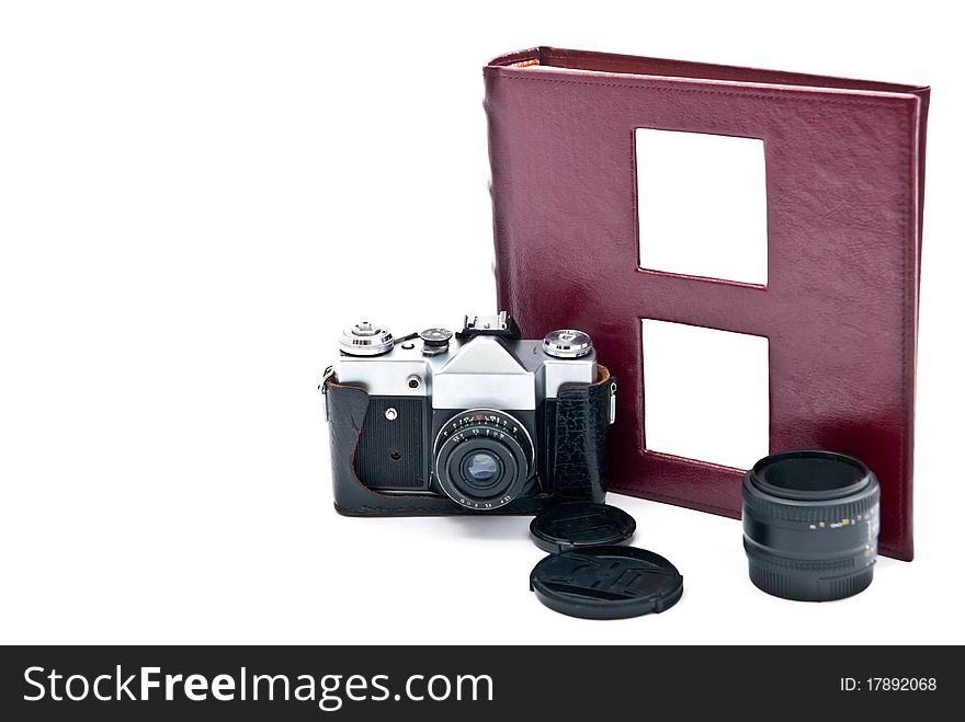 Vintage camera and red photo album. Isolated on white. Vintage camera and red photo album. Isolated on white