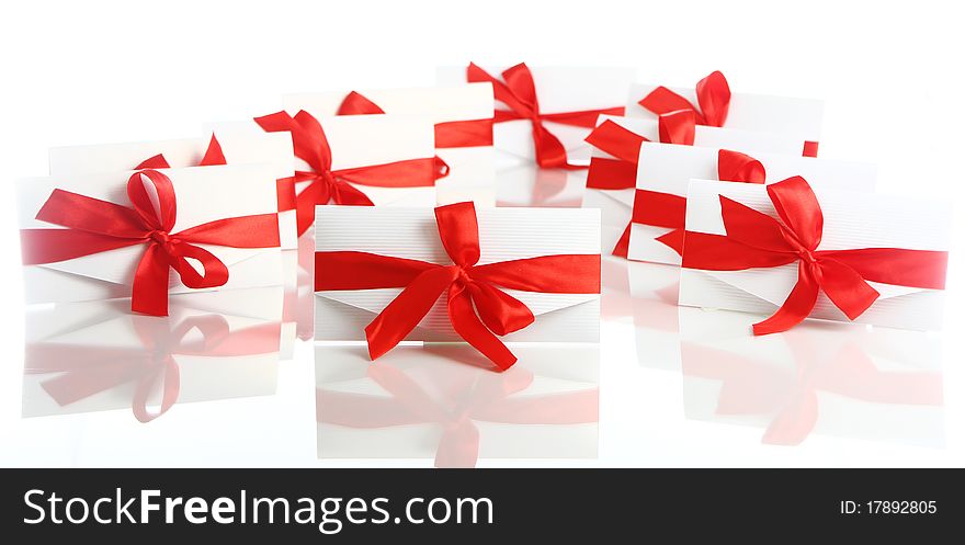 Gift envelopes with awesome red bows isolated on white. Gift envelopes with awesome red bows isolated on white