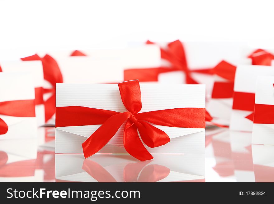 Gift envelopes with awesome red bows isolated on white. Gift envelopes with awesome red bows isolated on white