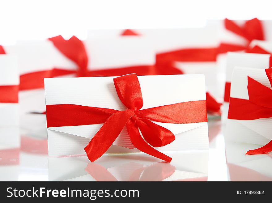 Gift envelopes with awesome red bows isolated on white. Gift envelopes with awesome red bows isolated on white