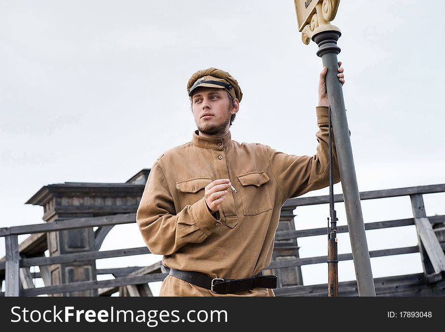 Retro style picture with smoking soldier.