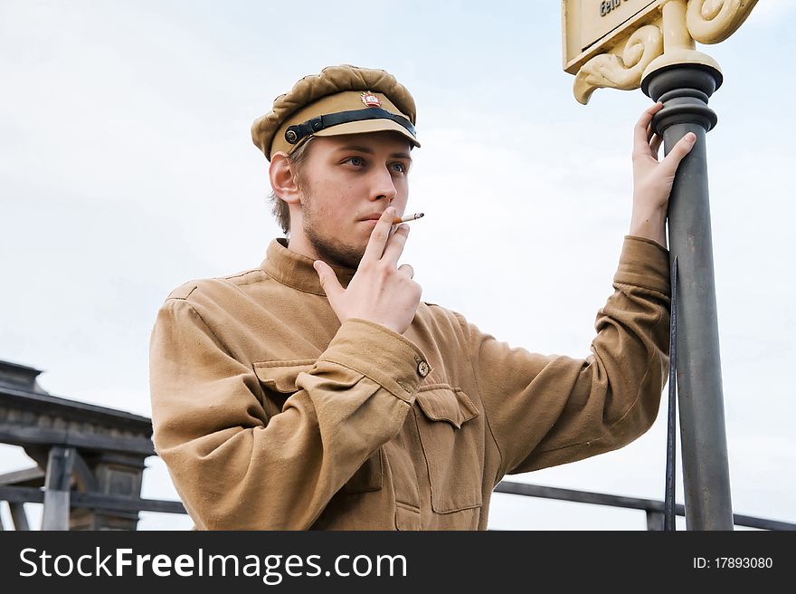 Retro style picture with smoking soldier.