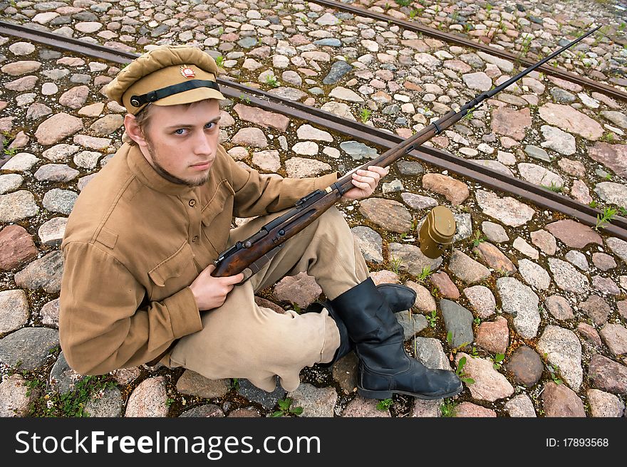 Soldier with boiler and gun in retro style picture