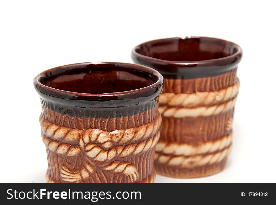 2 brown decorative cups on a white background