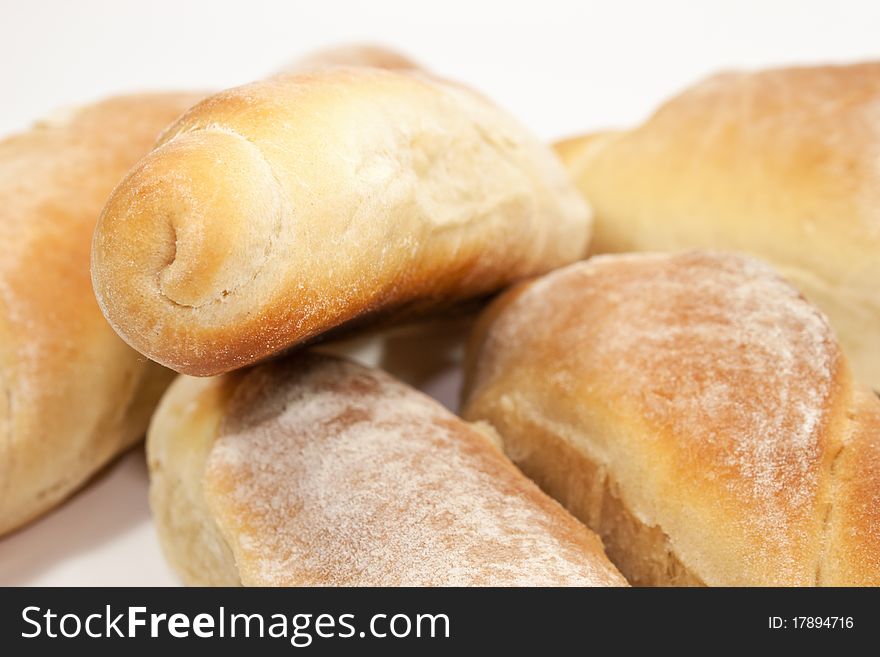 Yellow, beaked breads isolated on white background